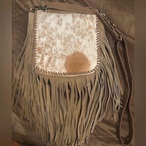 Handmade crossbody bag with real cowhide and fringe.